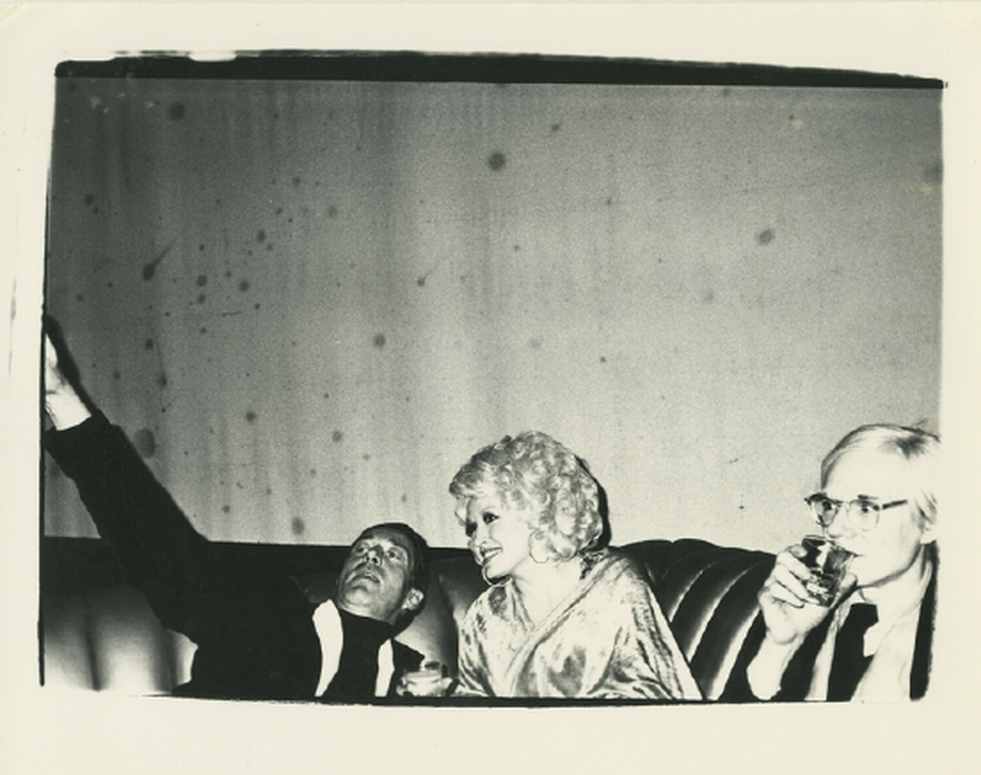 Halston, Dolly Parton & Andy Warhol on couch at Studio 54, 1978 (authenticated by the Warhol Estate and Foundation)